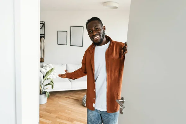 Welcome Happy African American Man Inviting Visitor Enter His Home — Foto de Stock