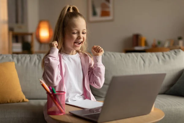 Joyful Little School Girl Laptop Computer Shaking Fists Winning Educational — 图库照片