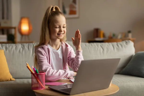 Cheerful Schoolgirl Raising Arm Laptop Having Online Class Video Call — 图库照片
