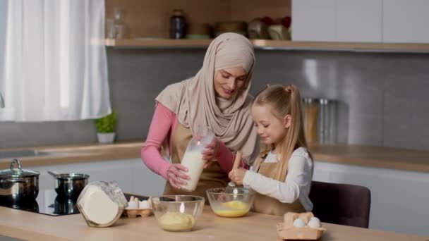 Little Helper Cute Girl Helping Her Muslim Mother Hijab Cook — стоковое видео