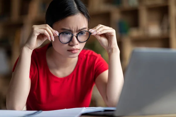 Serious Smart Young Japanese Girl Student Glasses Watching Online Lesson — Fotografia de Stock