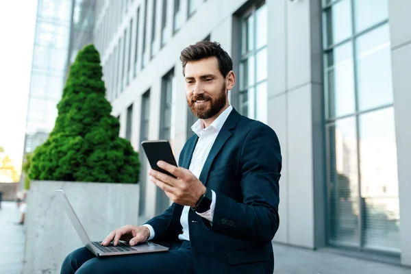Happy Young European Businessman Beard Suit Typing Phone Laptop Has — Foto de Stock