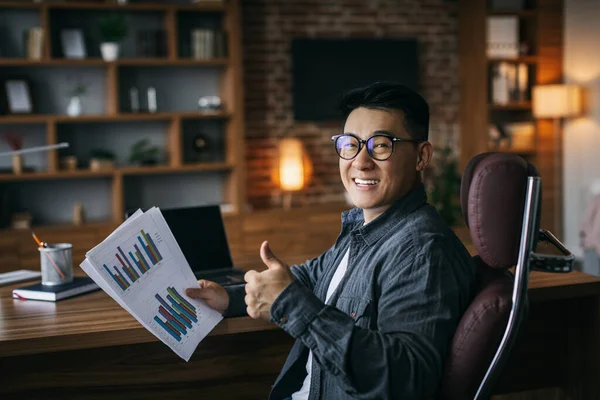 Happy Adult Asian Businessman Glasses Working Charts Showing Thumb Thinking — 스톡 사진