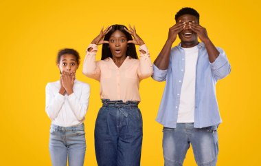 Hear no evil, see no evil, speak no evil. Black family of three people showing blind, deaf and dumb, 3 monkey scenes. Man, woman and girl covering eyes, ears and mouth