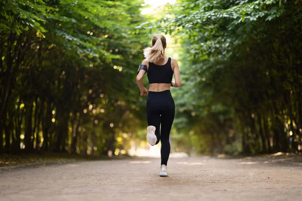 Slim Well Fit Woman Tight Black Sportswear Jogging Alone Green — Foto de Stock