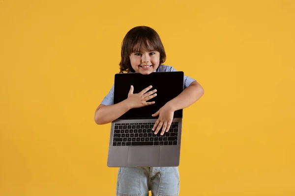 Modern Technologies Kids Cute Little Boy Carrying Open Laptop Smiling — Zdjęcie stockowe