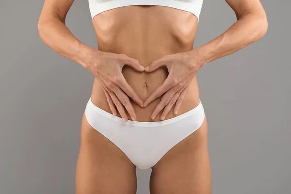 Bodycare Concept Cropped Shot Slim Female White Underwear Making Heart — Stockfoto