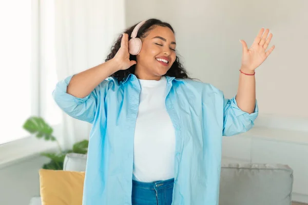 Happy African American Woman Wearing Earphones Listening Music Online Dancing — Foto de Stock