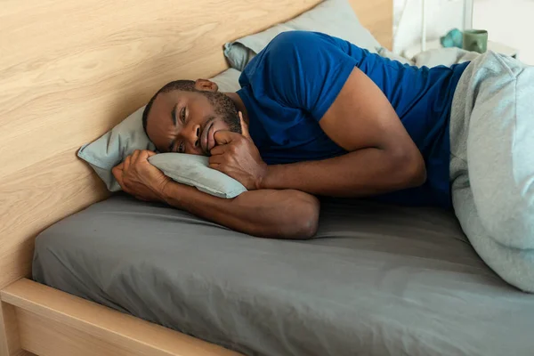 Black Man Sleeping Embracing Pillow Lying Bed Modern Bedroom Indoor — 스톡 사진