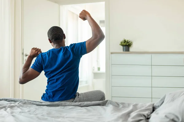 Good Morning Unrecognizable Black Guy Stretching Arms Sleep Sitting Bed — Fotografia de Stock
