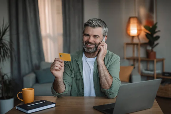 Glad Retired Caucasian Male Beard Calls Smartphone Uses Credit Card — Stock Fotó