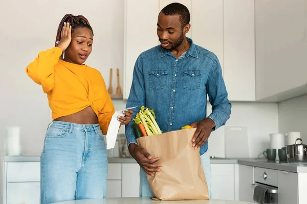 Shocked Black Spouses Paper Bag Food Checking Grocery Bill Woman — Fotografia de Stock