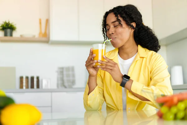 Young African American Woman Drinking Fresh Orange Mango Juice Glass — Stockfoto