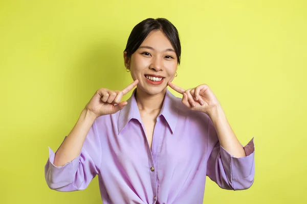 Toothy Asian Female Pointing Fingers Her Smile Posing Looking Camera — Fotografia de Stock