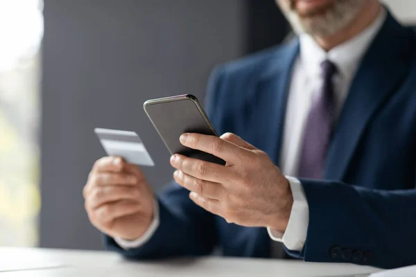Unrecognizable Businessman Making Online Payments Credit Card Smartphone While Sitting — Fotografia de Stock