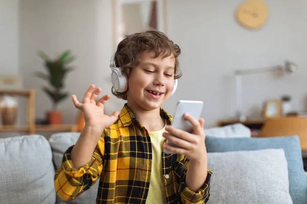 Online Communication Positive Little Boy Wearing Headset Video Chatting Friends — ストック写真