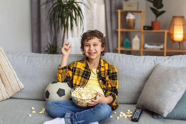 Home Alone Happy Little Boy Having Fun Watching Football Eating — Stock fotografie