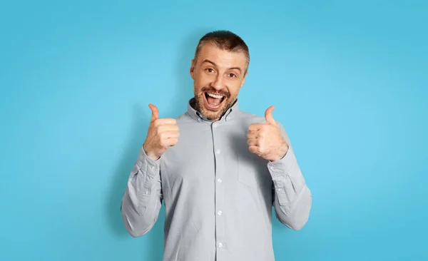 Joyful Middle Aged Male Gesturing Thumbs Both Hands Smiling Camera — Stockfoto