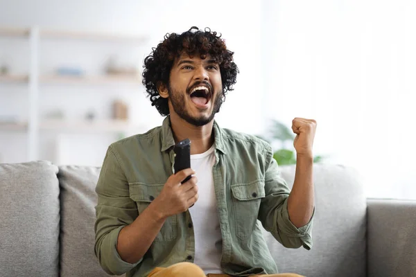 Emotional Young Indian Man Cheering Football Game Television Home Hindu — Foto de Stock