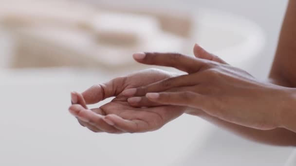 Black Unrecognizable Woman Rubbing Pampering Cream Her Hand Moisturizing Skin — Video