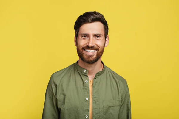 Portrait Happy Middle Aged Man Posing Smiling Camera Yellow Studio — Fotografia de Stock