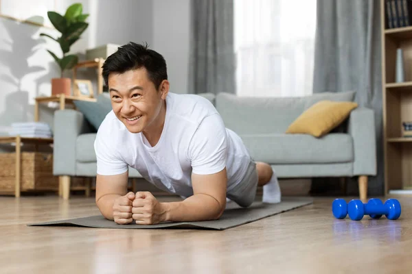 Motivated Handsome Middle Aged Asian Man Sportswear Having Workout Home — Stockfoto