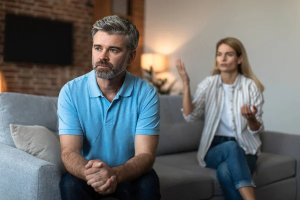 Offended Unhappy Mature Caucasian Woman Scolds Sad Husband Man Ignores — Stock Photo, Image
