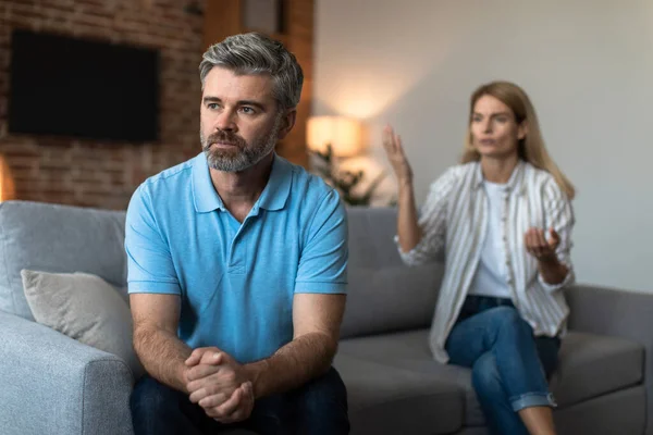 Offended Unhappy Mature Caucasian Woman Scolds Sad Husband Man Ignores — Stock fotografie