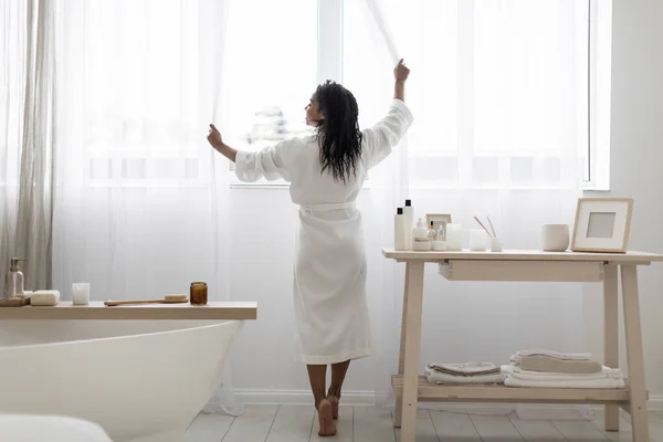 Attractive Young Black Woman Opening Curtains While Making Morning Beauty — 스톡 사진