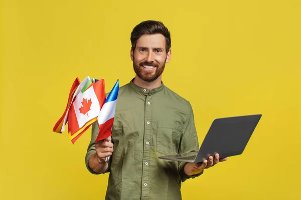 Learn Foreign Languages Happy Man Holding Laptop International Flags Middle — Fotografia de Stock