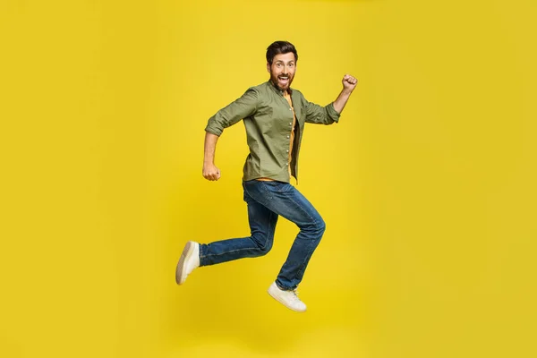 Portrait Middle Aged Man Running Yellow Background Side View Shot — Stok fotoğraf