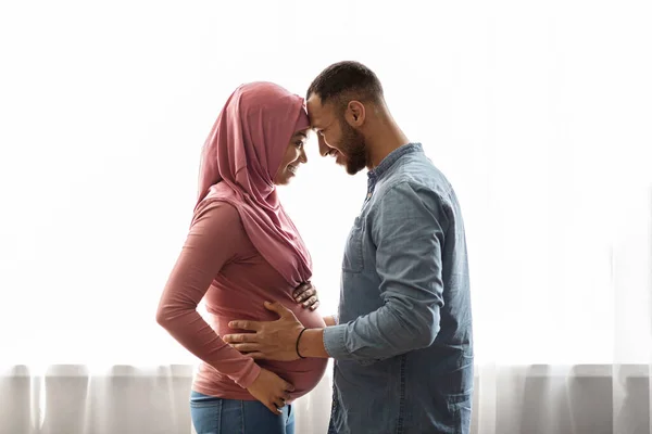 Pregnant Black Muslim Woman Her Happy Husband Hugging Window Home — Foto de Stock