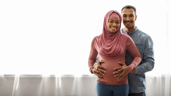 Portrait Joyful Beautiful Black Muslim Couple Expecting Baby Posing Window — Stock fotografie