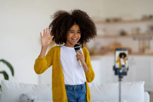 Cheerful Pretty Little Black Girl Casual Singing Recording Video Waving —  Fotos de Stock