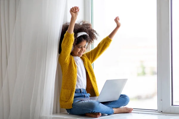 Emotional Black Little Girl Wireless Headset Using Laptop Home Sitting — Foto Stock