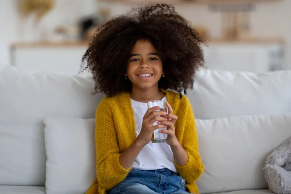 Cheerful Pretty Little Black Girl Bushy Hair Sitting Couch Home — Foto de Stock