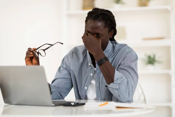Black Male Freelancer Suffering Eyes Strain Taking Glasses Massaging Nose — стокове фото