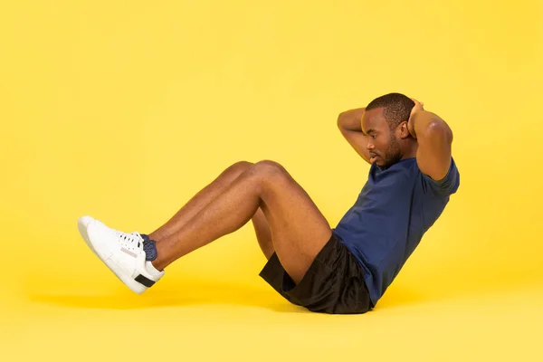 Side View African American Guy Flexing Abs Muscles Doing Sit — стоковое фото