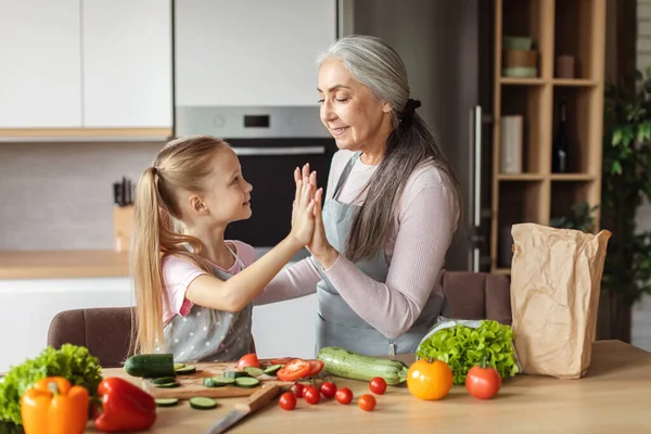 Smiling European Small Girl Old Grandmother Preparing Salad Organic Vegetables — Fotografia de Stock