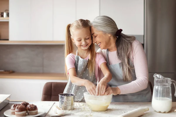 Satisfied Old Female Apron Hugs Little Granddaughter Make Dough Have — Φωτογραφία Αρχείου