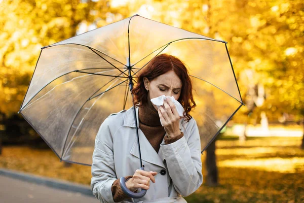 Sad Young European Female Raincoat Umbrella Blows Her Nose Napkin — Stockfoto