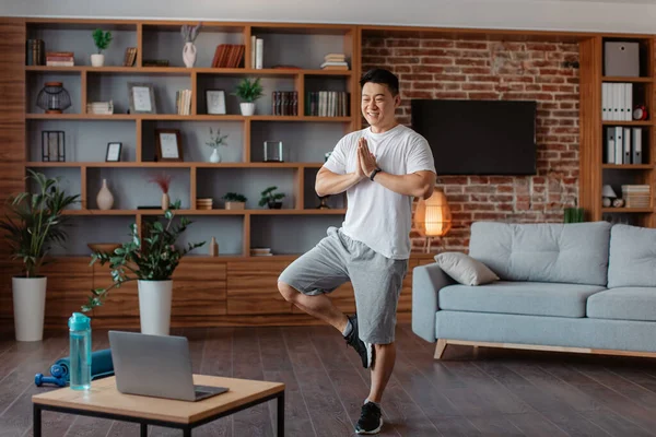Positive Korean Mature Man Attending Online Yoga Class Standing Tree — Stok fotoğraf