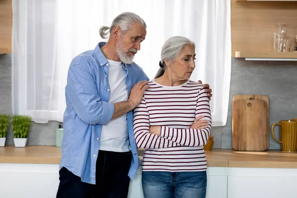 Caring Senior Man Comforting His Offended Wife Kitchen Home Worried — Stock Photo, Image