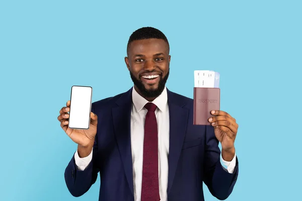 Handsome Black Businessman Showing Blank Smartphone Holding Passport Tickets Smiling — 图库照片