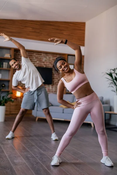 Cheerful Young African American Husband Wife Sportswear Doing Stretching Warm — стоковое фото