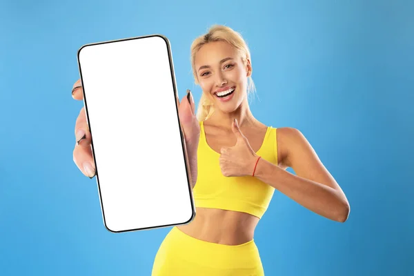 Fitness App Sporty Young Woman Holding Big Blank Smartphone Showing — стоковое фото