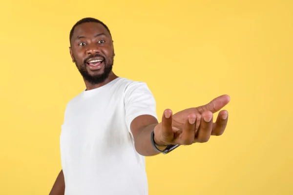 Excited African American Man Holding Invisible Object Showing Advertising Your —  Fotos de Stock