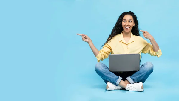 Smiling Middle Eastern Lady Using Laptop Pointing Fingers Aside Empty — Stok fotoğraf