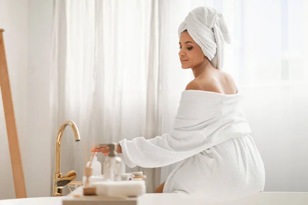 Beauty Care Relaxed Woman Enjoying Bodycare Rituals Using Cosmetics Sitting — Stock Fotó