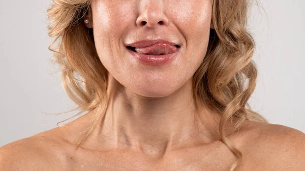 Cropped Image Beautiful Middle Aged Female Playfully Licking Lips Tongue — Stockfoto